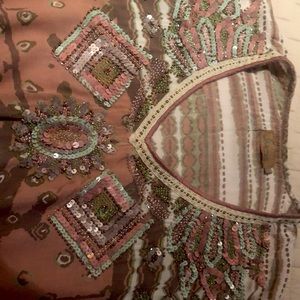 Ladies pull over beaded top. Size medium.